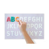 AlphaDough™ Playmat with A, B, C in modelling dough formed over the letters in red, blue and orange dough, with a child's hand positioning it