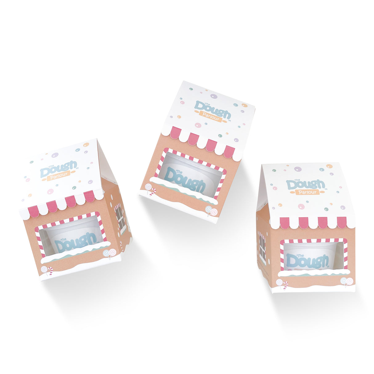 Gingerbread Stocking Stuffers boxes designed as mini gingerbread houses with dough tubs inside peeking through window on front of boxes